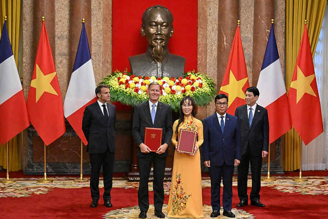 France, Vietnam sign deals worth  $10 billion as Macron visits Hanoi